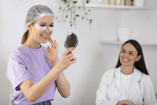 side-view-smiley-woman-looking-mirror-lash-appointment